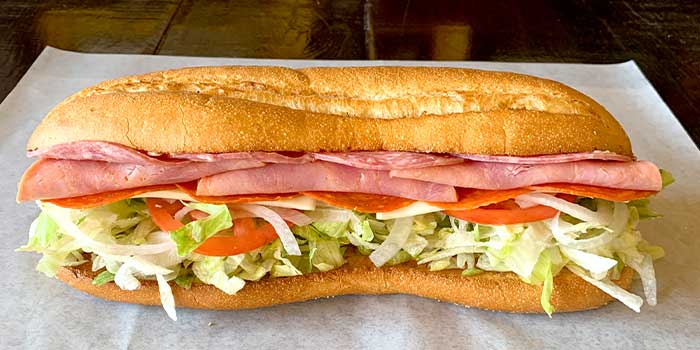 A delicious sub sandwich with meat cheese, lettuce tomatoes and other veggies served by Bob's Sub in Pennsylvania.